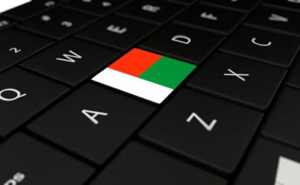 Rendu 3D gros plan du bouton drapeau de Madagascar sur le clavier d'un ordinateur portable-externalisation offshore à Madagscar-Buroservices