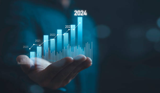 Homme d'affaires détenant un graphique technique virtuel pour l'analyse du marché en 2024 - externalisation en 2024 - Buro Services
