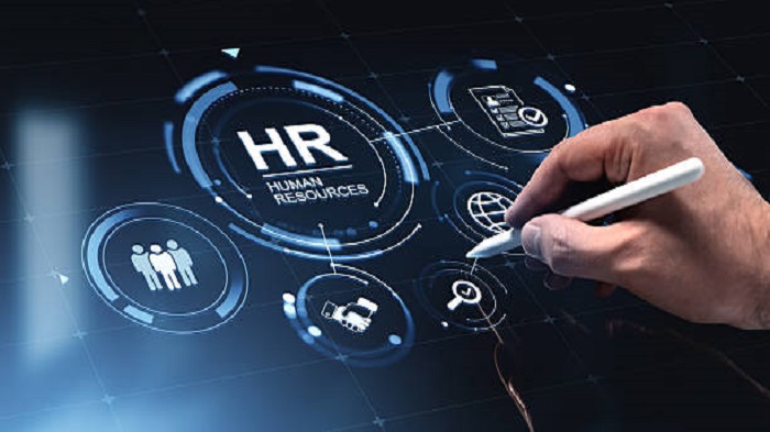 Une main interagissant avec un tableau de bord RH lumineux - Tarifs staff leasing Madagascar - Buro Services